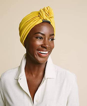 a model wearing the turban in yellow 