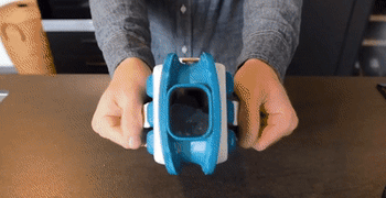 gif of person popping open icebreaker to add ice to water cup