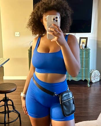 Reviewer in two-strapped tank top version of the blue set