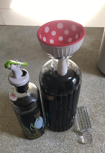 Mushroom flipped to act as a funnel for a soy sauce jar