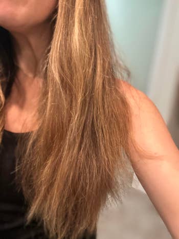 person with long, consecutive hairsbreadth shown successful close-up, wearing a sleeveless achromatic top
