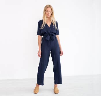 front of model wearing the navy jumpsuit