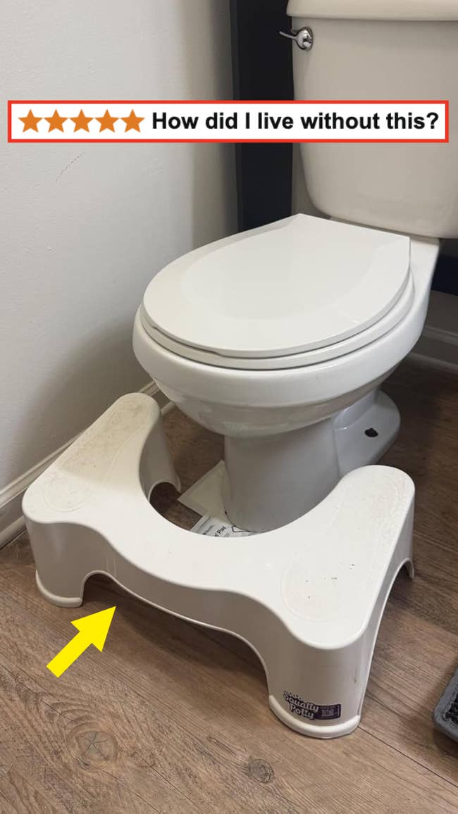 Toilet with a footstool positioned at its base; text reads, 