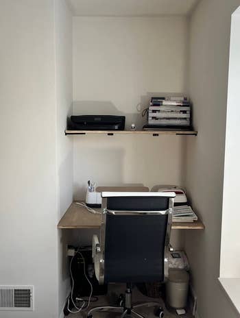 a reviewer's plain white walled home office