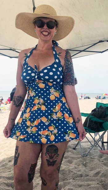 reviewer wearing the blue swimsuit with lemons on it