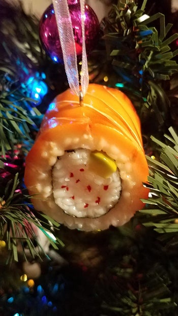 a reviewer's sushi ornament on their tree