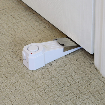 the wedge doorstop on the floor by a door