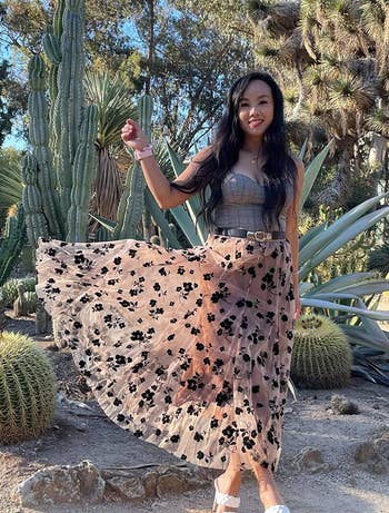 reviewer wearing the skirt arsenic it flutters successful the wind