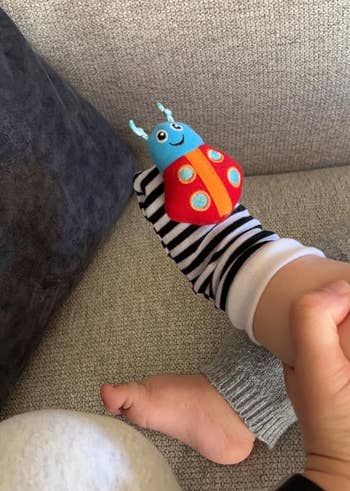 image of reviewer's baby wearing the rattle socks