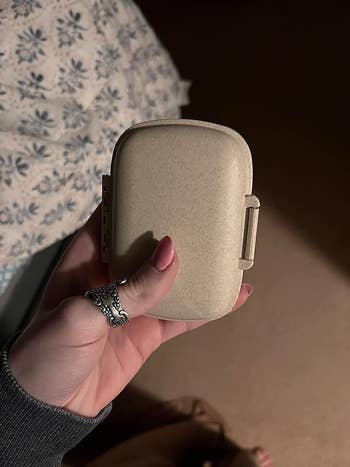 reviewer photo of the medicine holder closed to show its compact size