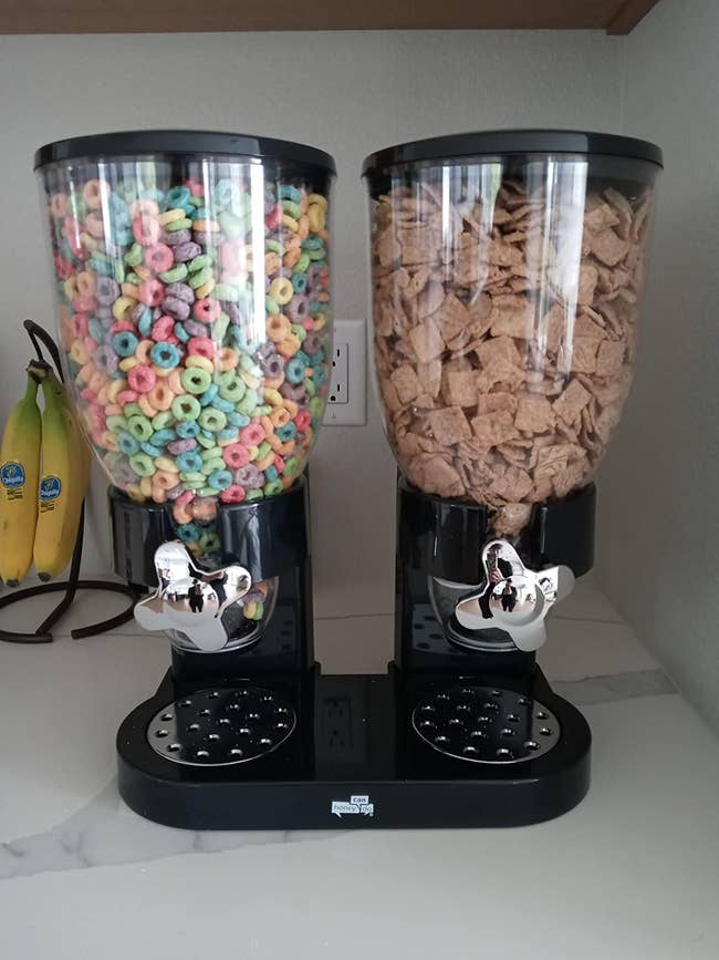 the black cereal dispenser holding two types of cereal