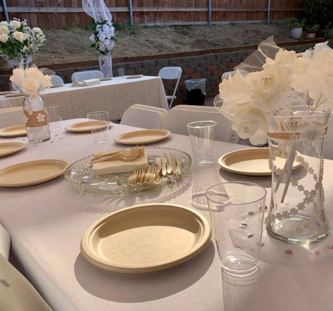 reviewer photo of the compostable dinnerware on an outdoor table