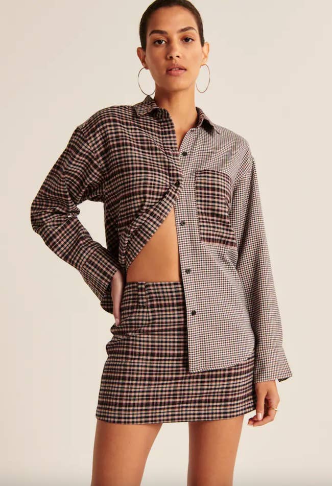 model wearing half-buttoned colorblock flannel shacket