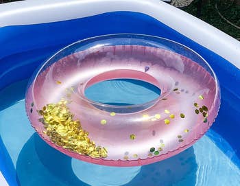 Reviewer's pink floatie in a pool