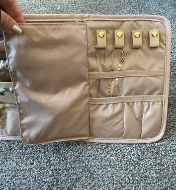 same reviewer showing the necklace and bracelet clasps in the jewelry organizer