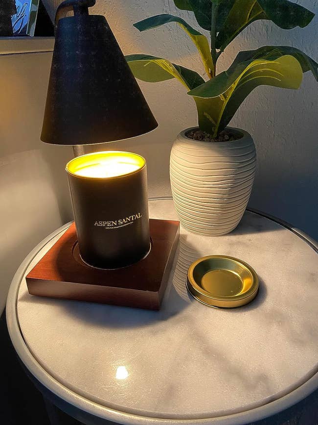 a candle lamp with a chic black shade