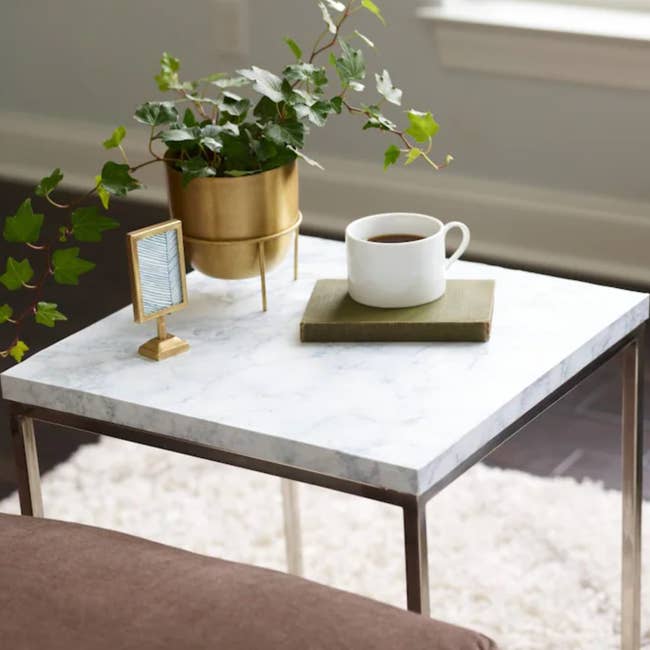 side table covered in the marble contact paper