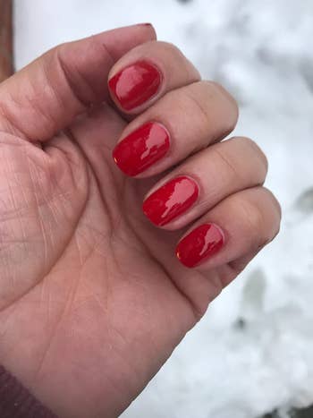 another reviewer with a red shiny manicure