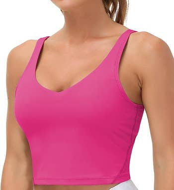 Model in pink v-neck sports bra cropped top 