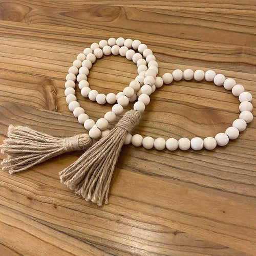 the farmhouse beads on a wooden background