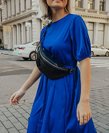 a different model wearing the bag in black