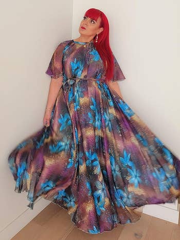 reviewer wearing peacock print short sleeve dress