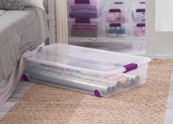 lifestyle image of rolling underbed storage bin with latch