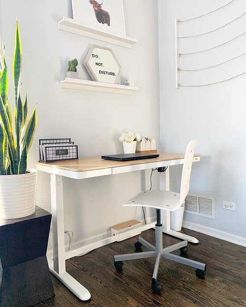 reviewer's desk with white frame and bamboo top