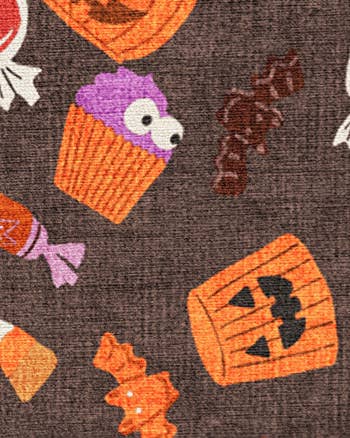 Halloween-themed cloth  with illustrations of a cupcake, jack-o'-lantern, candy wrappers, and sweets