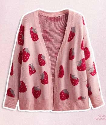 an open-front pink cardigan with a red strawberry pattern 