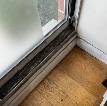 review's windowsill filled with dirt and dust