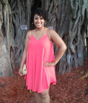 reviewer wearing the pink dress