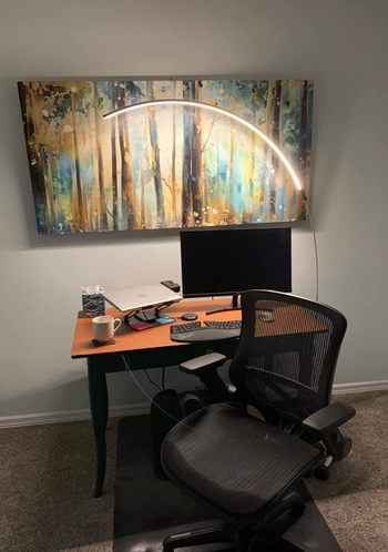 The same lamp hovering over a desk