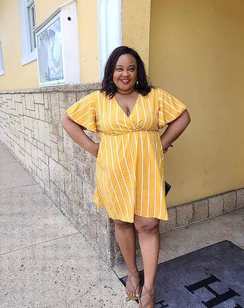 another reviewer in yellow and white striped  wrap dress