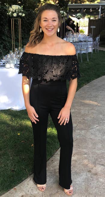 Image of reviewer wearing black lace jumpsuit