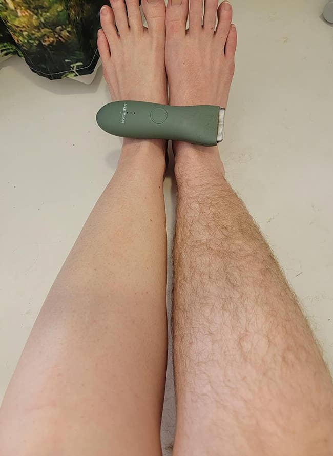 reviewer posing with razor with one shaved leg and one unshaved 