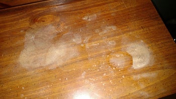 reviewer's wood dresser with large water stains