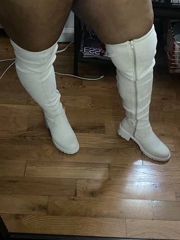 reviewer wearing off white over-the-knee boots