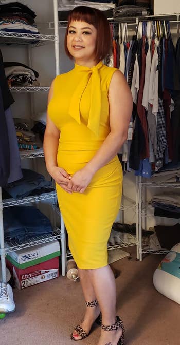 Image of reviewer wearing yellow dress