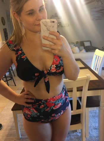 reviewer wearing floral two piece in mirror selfie