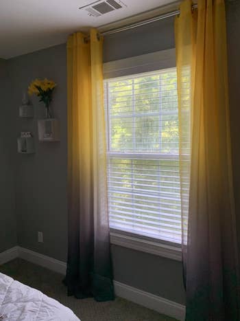 yellow and gray ombre curtains hung in a window