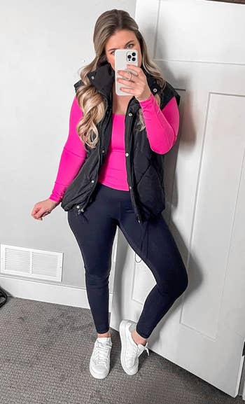  achromatic  puffer vest, pinkish  top, achromatic  leggings, and achromatic  sneakers
