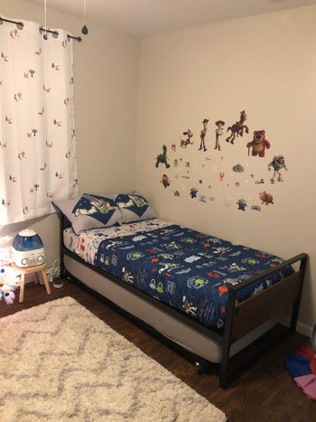 reviewer photo of twin daybed with kids' sheets