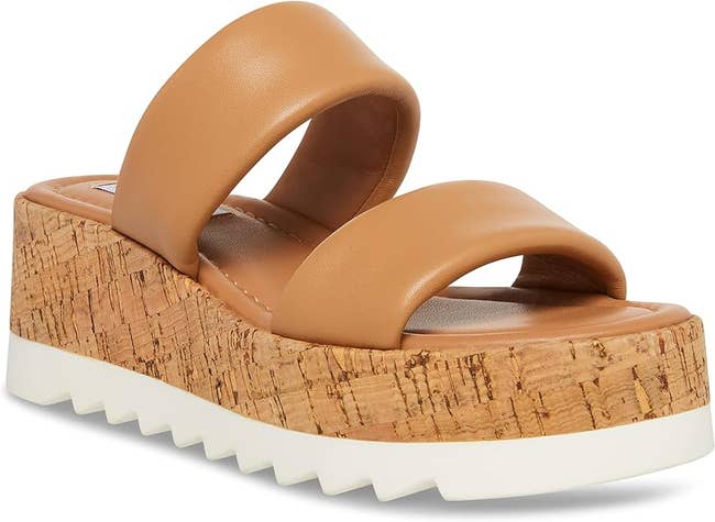 Tan platform sandal with cork heel and white sole, displayed for shopping