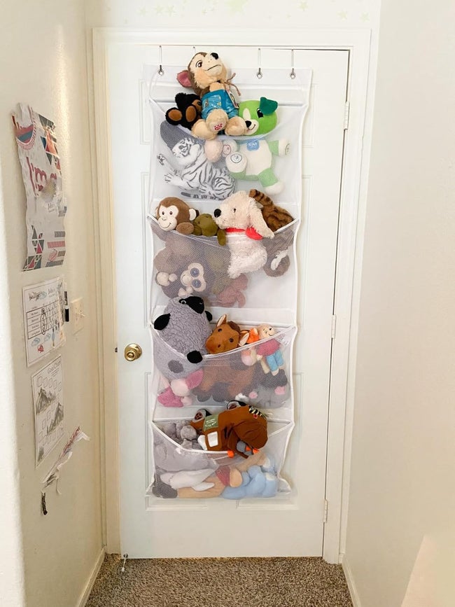 Stuffed animals stored in over-the-door pockets