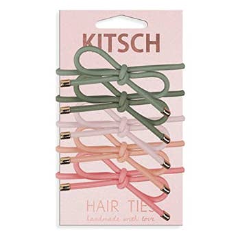 set of kitsch elastics with bows in different shades of pink and olive green