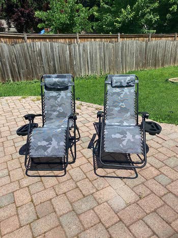 Reviewer's two zero gravity chairs with camo design