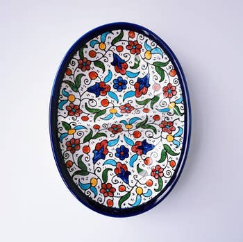 Hand-painted ceramic half-split plate in colorful style