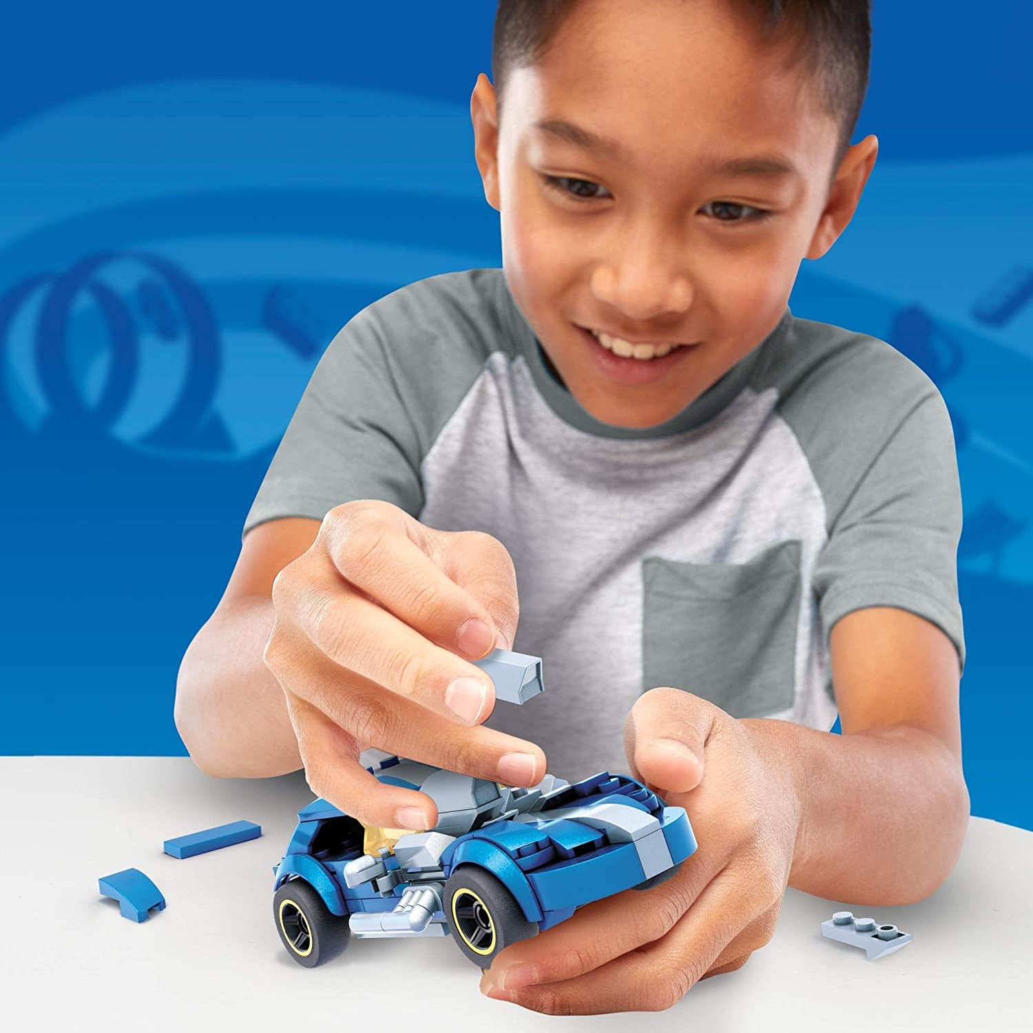 Child model assembling blue toy car