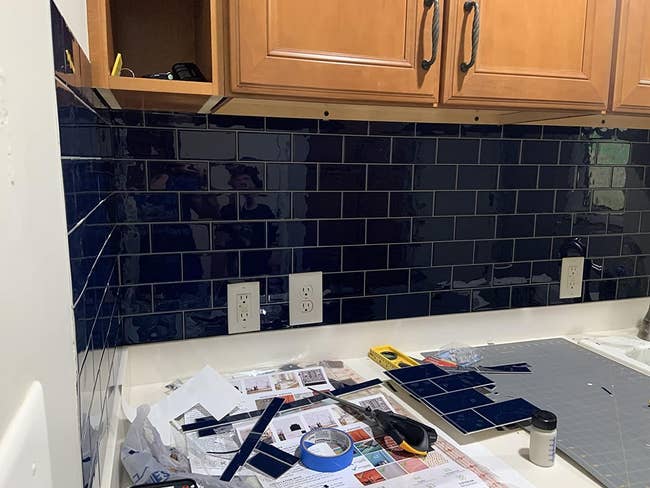 deep blue peel and stick subway tiles as a kitchen backsplash